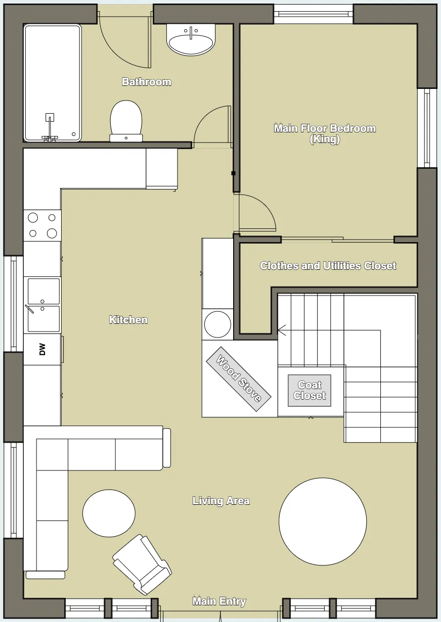 Main floor plan of The Cascade Chalet showing the king bedroom, full bathroom, kitchen, living area with wood stove, coat closet and main entry